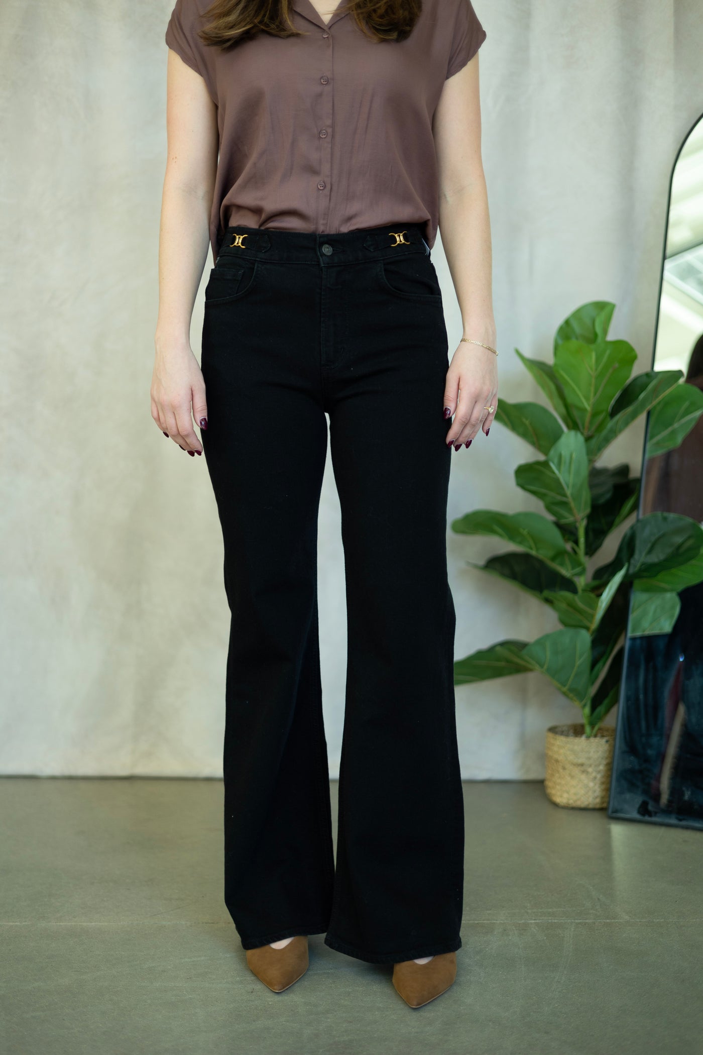 Black flare jeans with gold buckles