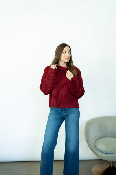 Red turtleneck sweater with wide sleeves
