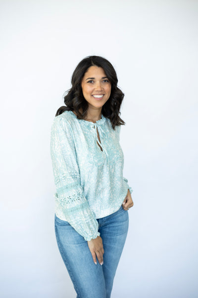 Light teal long sleeve blouse