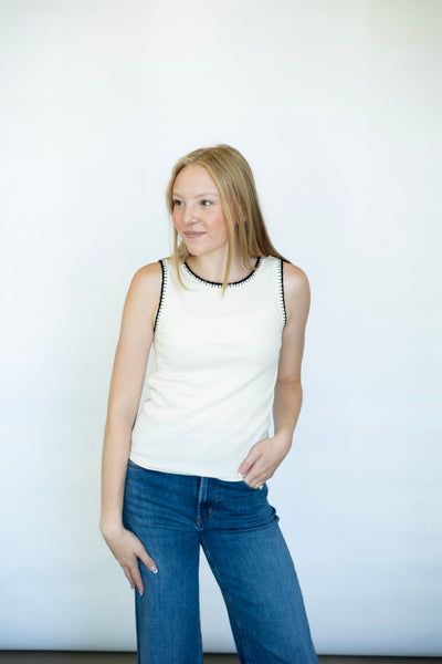 Cream tank top with black stitched detailing