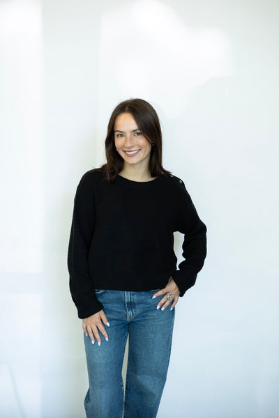 Black sweater with buttons on shoulder
