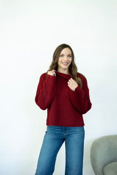 Red turtleneck sweater with wide sleeves