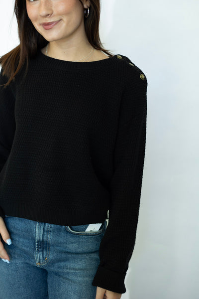 Black sweater with buttons on shoulder