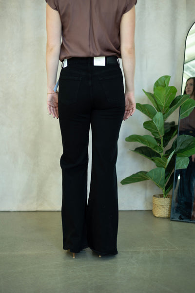 Black flare jeans with gold buckles