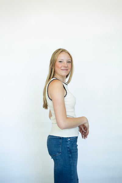 Cream tank top with black stitched detailing