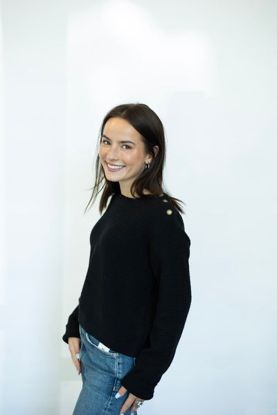 Black sweater with buttons on shoulder