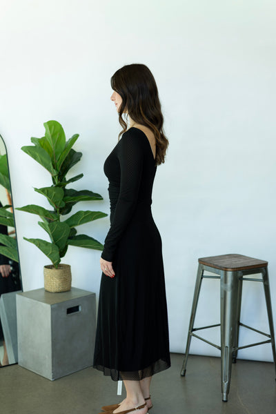 Long, black dress with polka dots