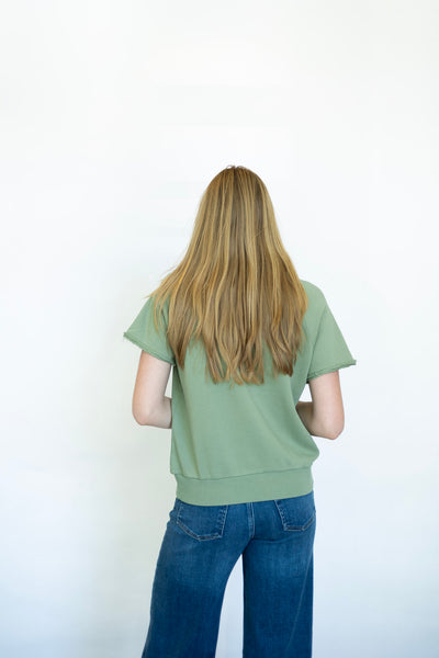 Casual green tee with cut out neckline