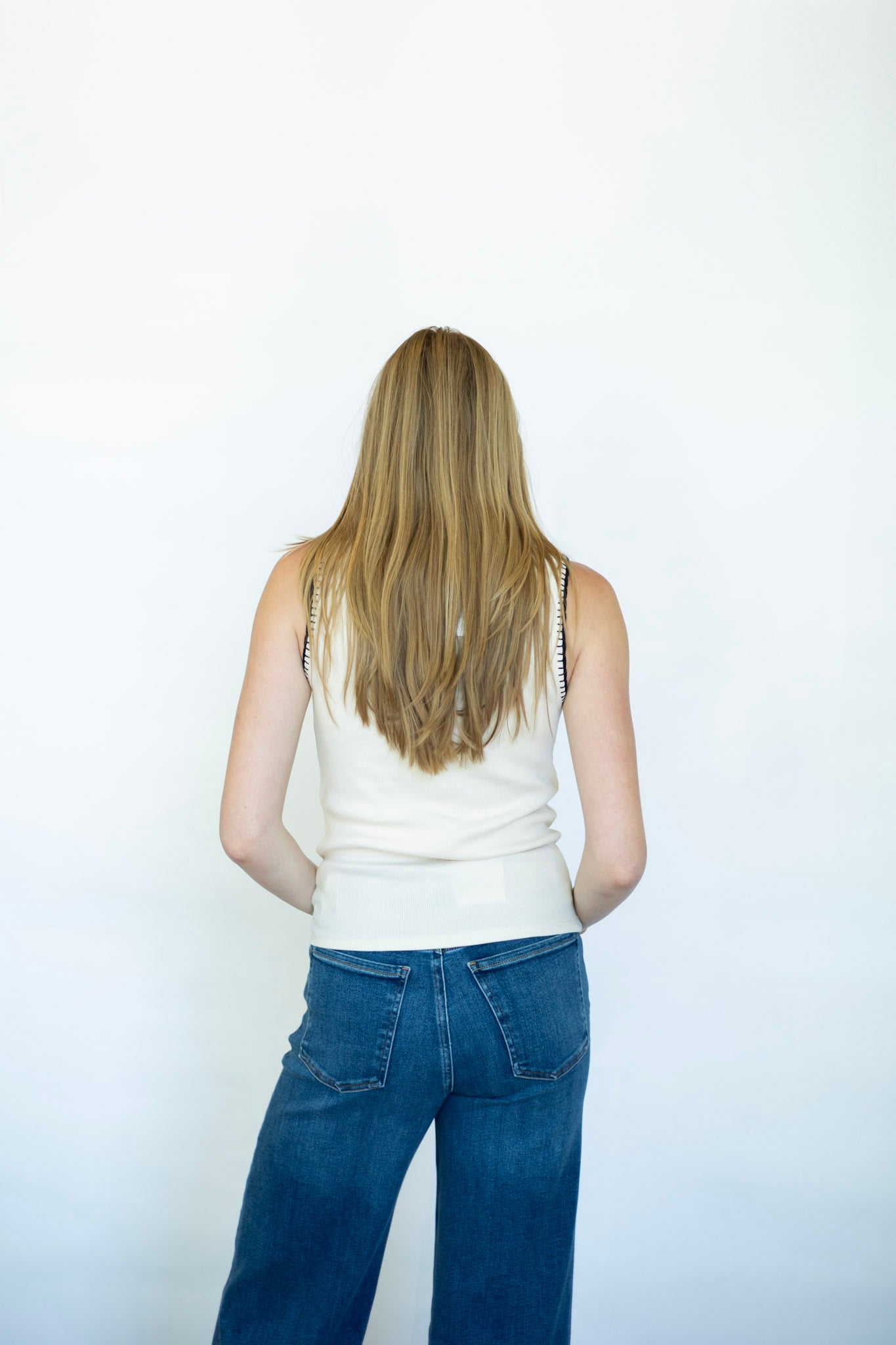 Cream tank top with black stitched detailing