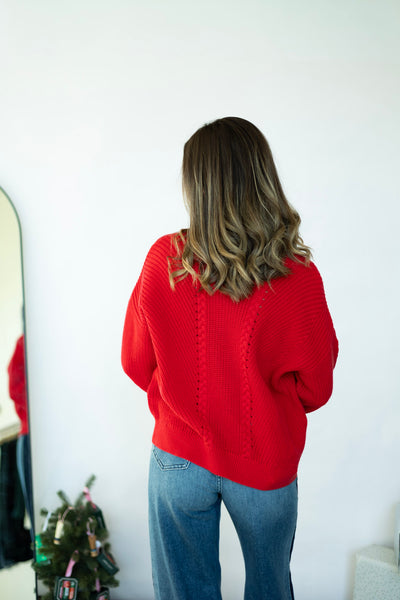 Bright red knitted sweater