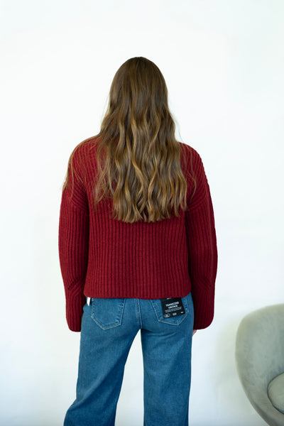 Red turtleneck sweater with wide sleeves